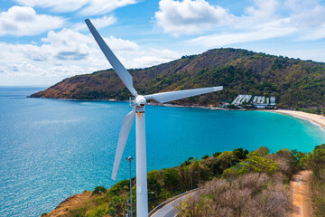 Wind turbine on mountain and blue ocean background with copy space for text. - obrazy, fototapety, plakaty