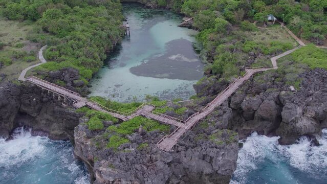 Wide shot of the famous weekuri lagoon with no people at Sumba Indonesia, aerial