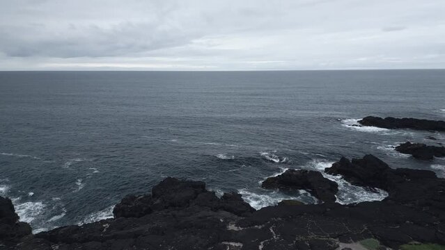 Oceanfront bird angle view in a gloomy evening, Atlantic ocean on it&acute;s calm