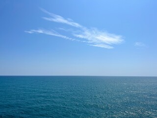 Sea blue glittering water clear sky horizon seascape. 