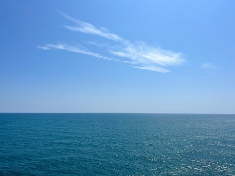Sea blue glittering water clear sky horizon seascape. 