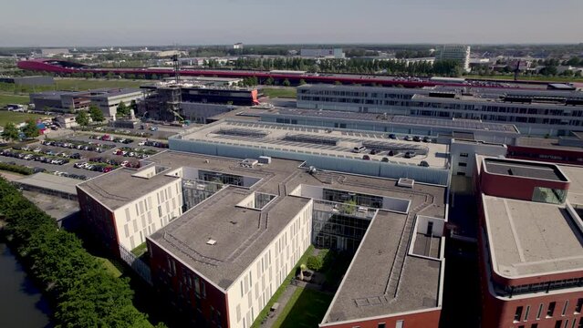 Aerial ascend revealing Dutch Antonius medical care facility hospital in city of Utrecht in contemporary newly build Leidsche Rijn neighbourhood