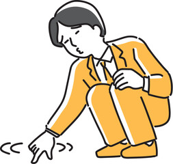 地面をグリグリしていじける会社員