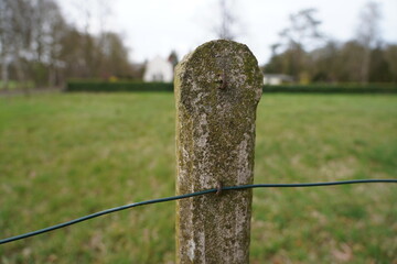 Old stony fence post