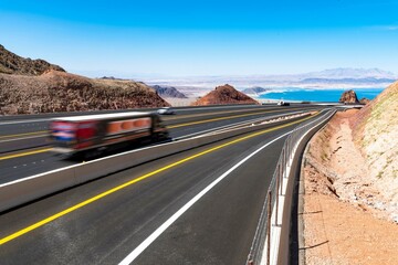 Majestic Journey: Lake Mead Road near Las Vegas, Embraced by Forest Trees on a Stormy Morning, Immortalized in Mesmerizing 4K Resolution