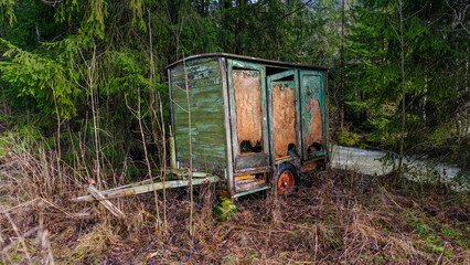 old rusty caravan in nature