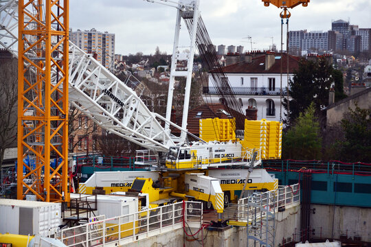 Arcueil-Cachan, France - January 13th 2019 : crane Liebherr LG 1750, used for a construction site for extending the underground line 15. This crane is one of the biggest of the world, and can carry 75