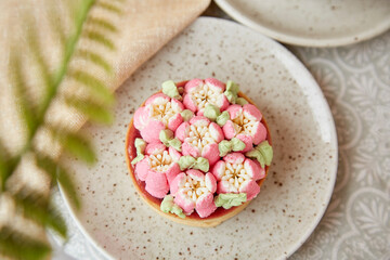 Trendy french tart with flowers. Pink, surreal, escapism flowers cake. Three- dimensional layers background