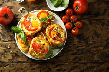 Homemade pastry with tomato and cheese