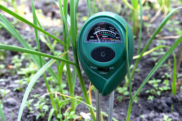 Ph meter for measuring the level of alkali in the ground for plants. A device for monitoring the...