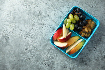 Healthy lunchbox with fruits and cookies