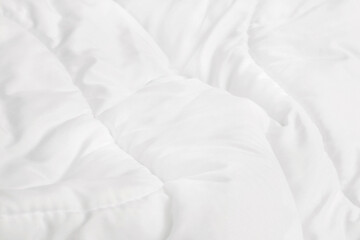 Close up top view of white bedding sheet and wrinkle messy blanket in bedroom after wake up in the...