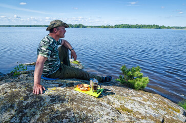 Man enjoying coffee time in lake scenery - 619720357