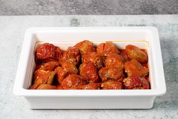 Stuffed peppers on gray background. Traditional Turkish delicacies. healthy appetizers. Local name kuru biber dolması