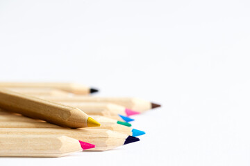 Colour pencils isolated on white background, close up.