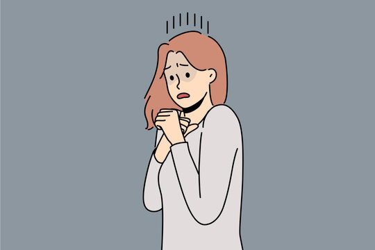 Frightened woman is afraid of resounding sounds or movements and is panicking due to psychological health problems. Frightened young girl needs protection or treatment for panic attacks