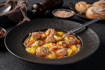 Plate with meatballs soup, traditional plate of the Romanian cuisine - Ciorba de perisoare.
