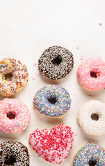 Glazed colored donuts.