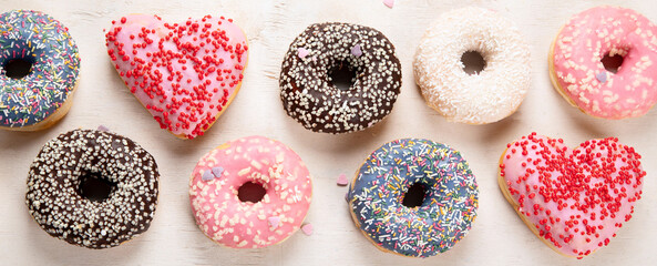 Glazed colored donuts.