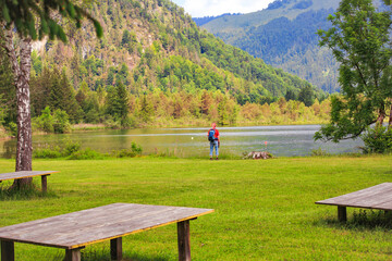 Fototapeta na wymiar A man is looking at the Walchsee, Tirol - Austria