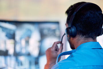 Police dispatch, communication headset and man talking, speaking and consulting with security,...