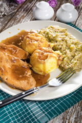 Stewed turkey meat in gravy.