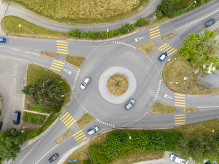 Aerial view of roundabout in Switzerland. Road junction in overhead view.