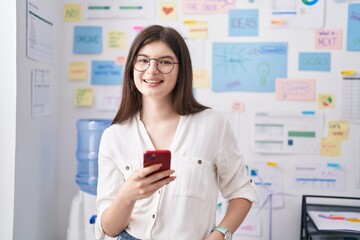 Young caucasian woman business worker using smartphone working at office