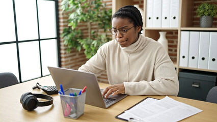 African american woman business worker using laptop working at office