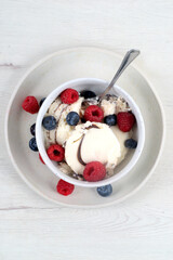 Bowl with mint mousse and red fruits