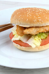 Chicken burger with lettuce and tomato