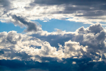 A clouded blue sky background. Sky with clouds weather nature cloud blue and dark.