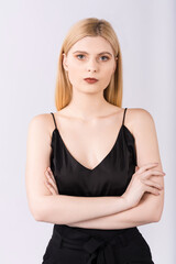 Fototapeta premium Portrait of an elegant and beautiful blonde girl on a white background