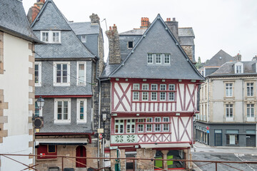 Morlaix, Brittany, France - 2022 August 21: Traditional French facade of a town house located in Morlaix, Typical houses of French Brittany - obrazy, fototapety, plakaty
