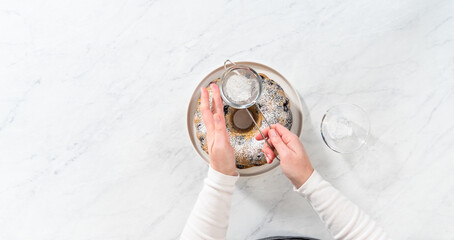 Lemon blueberry bundt cake with powdered sugar dusting