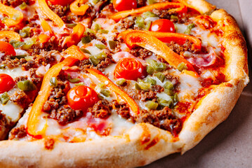 Pizza with Mozzarella cheese, Bolognese sauce, minced meat, pepper, tomato, bacon and vegetables