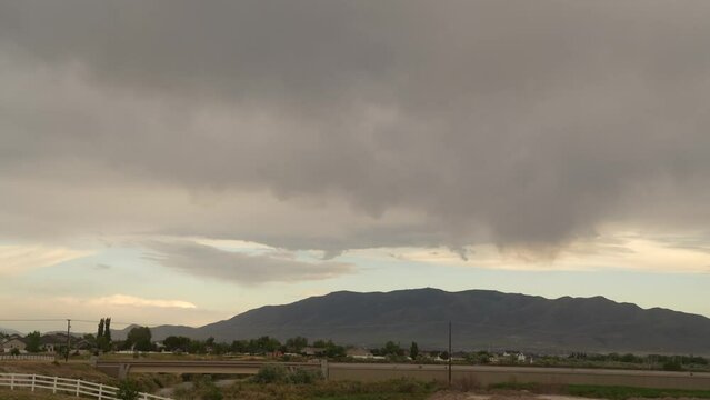 Rainclouds and precipitation over a Eagle Mountain, Utah - time lapse