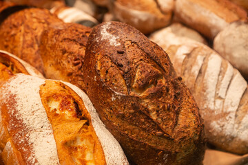 Background of loaves of bread on a bakery showcase.