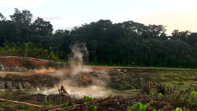 A powerful pyrotechnical explosion. Hard rock is broken up in a powerful explosion to build a dam. Central Africa