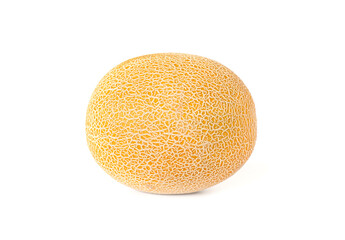 Yellow melon with textured skin on a white background