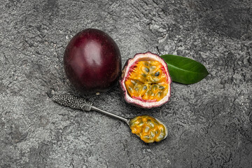 Passion fruit Maracuya cut in half slice on a dark background, Long banner format. top view