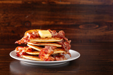 sweet pancakes with butter and bacon. traditional american breakfast