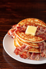 sweet pancakes with butter and bacon. traditional american breakfast