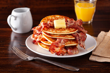sweet pancakes with butter and bacon. traditional american breakfast