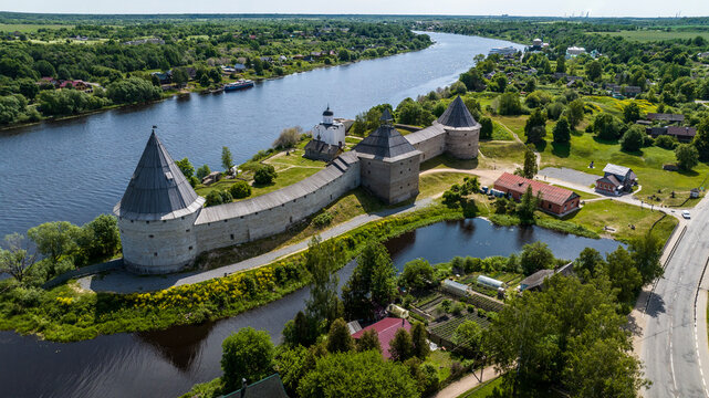 panoramic view of the ancient stone fortress in Staraya Ladoga on a sunny day shot from a drone