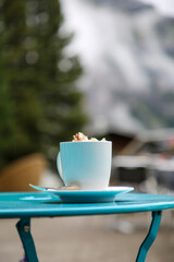Cup of Hot Chocolate with Mountain Landscape in the background