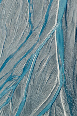 An aerial view of Glacier water from Mount Cook flowing through the Waiho River in Franz Josef, Southland, New Zealand. 