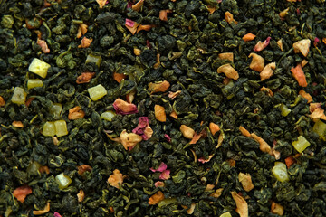 Loose Leaf Mango Pineapple Fruit Tea Wallpaper. Mix Black and Green Dry Tea Leaves. Close Up,...