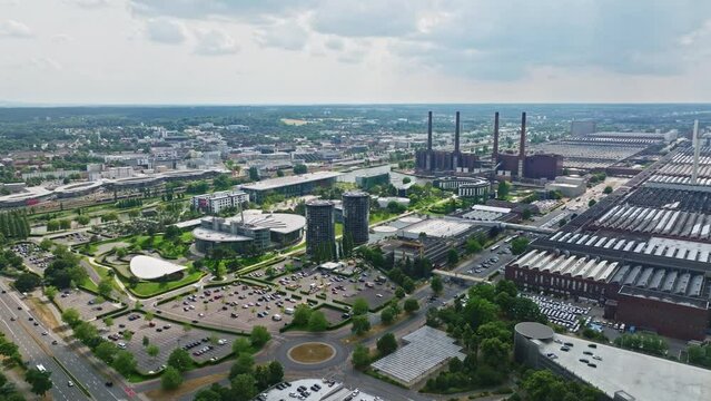Drone shot of Wolfsburg city , Germany . It's known as the headquarters for Volkswagen and for the Autostadt, an automobile-themed park with a classic-car museum and driving track.
