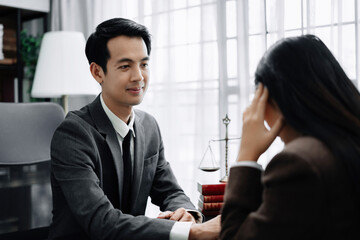 Fototapeta premium Legal advisers encourage clients. Justice and lawyer concept in the office.